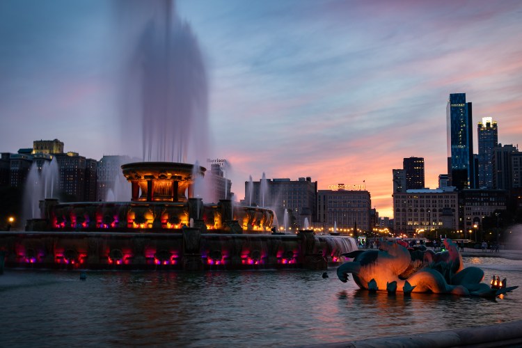 a large, ornate fountain in chicago's grant park at dusk