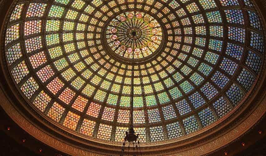 The rainbow stained glass dome roof of the Chicago Culture Center