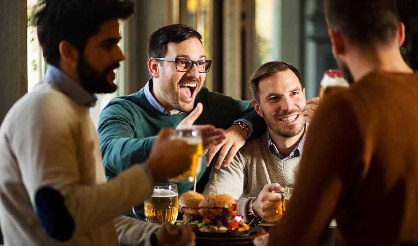 A group of friends having beer and food